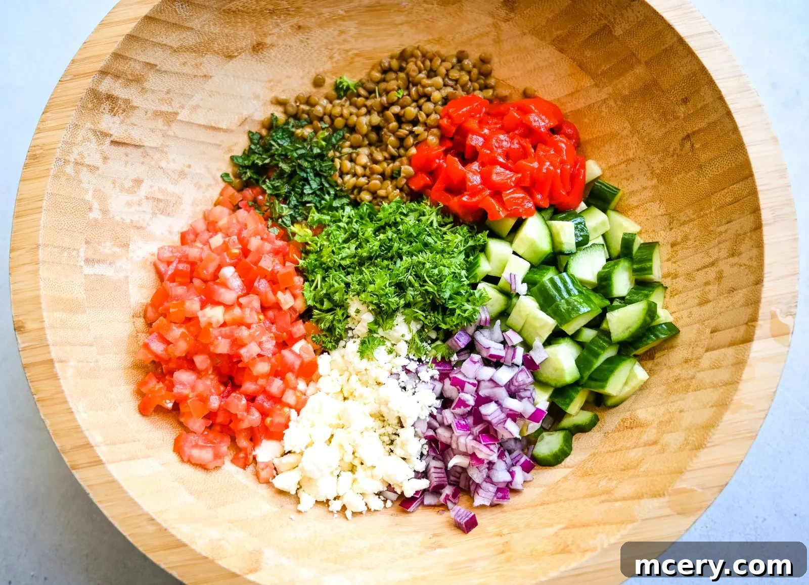 Deliciously Simple Lentil Salad 6 A bowl of cooked green lentils, perfectly tender and cooled.