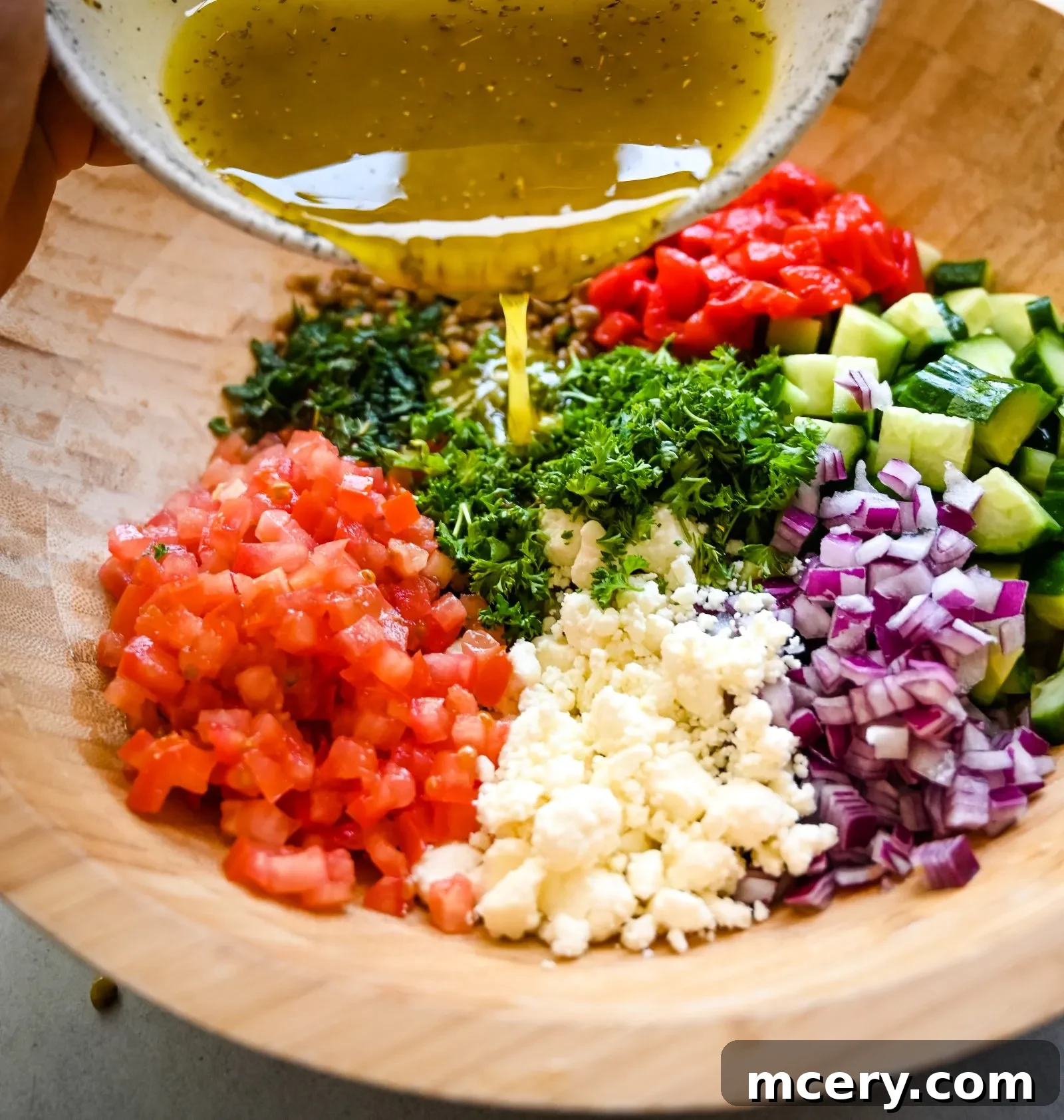 Deliciously Simple Lentil Salad 7 All the fresh vegetables for the lentil salad, including tomatoes, cucumbers, and roasted red peppers.