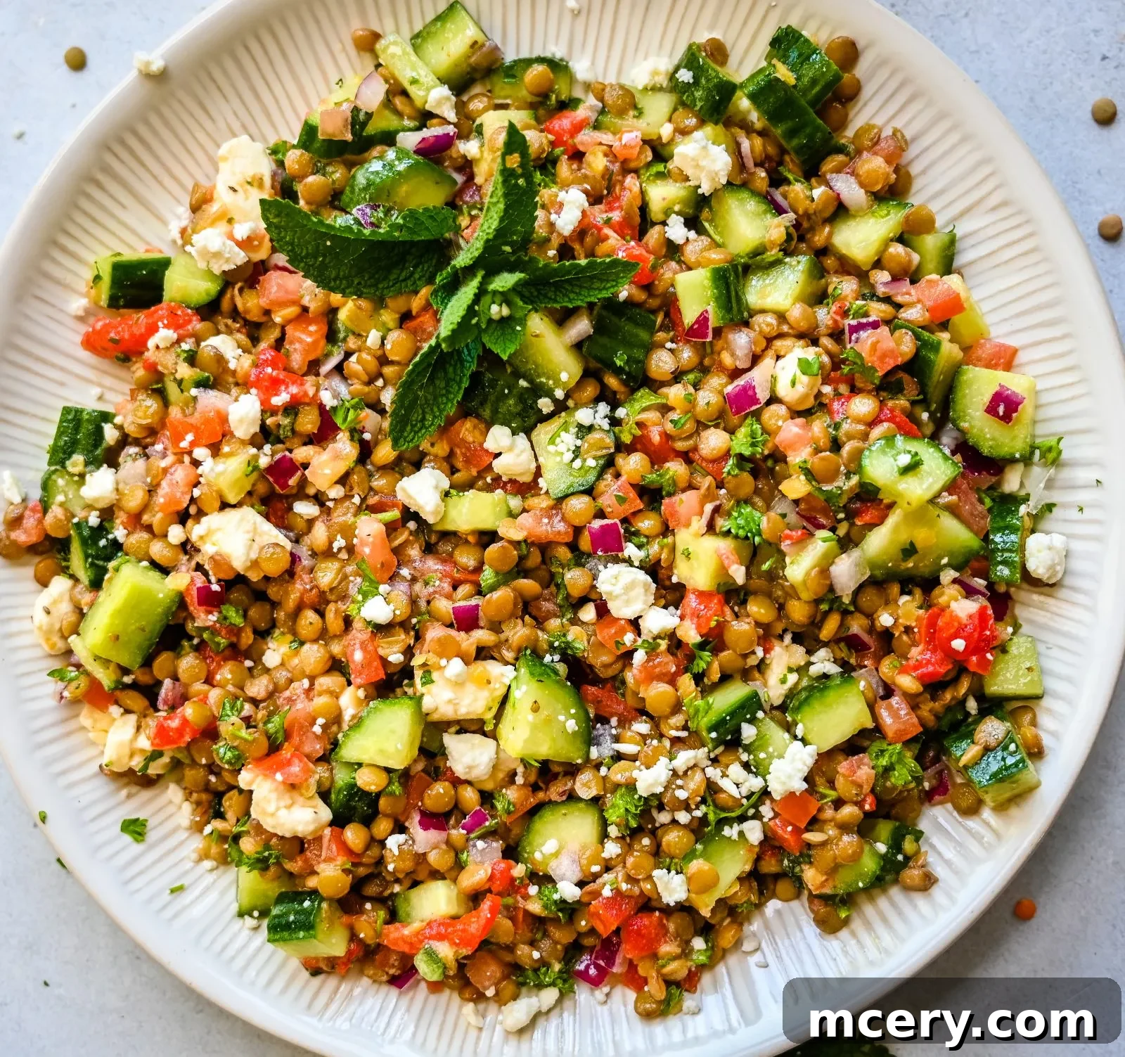 Deliciously Simple Lentil Salad 9 The lemon vinaigrette dressing being whisked in a small bowl.
