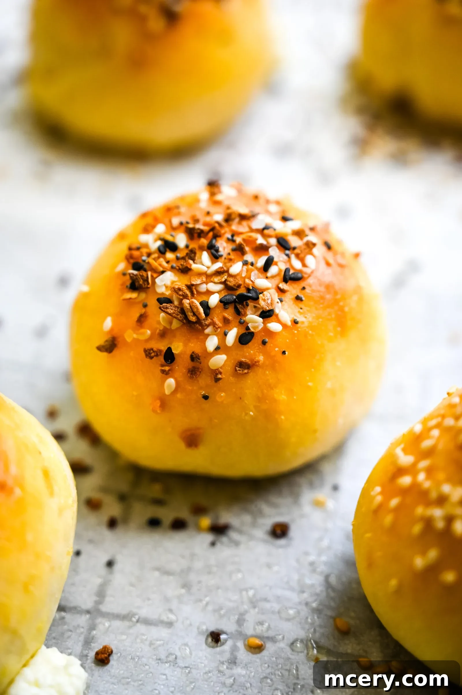Bagel Bombs 16 Close-up of a halved stuffed bagel bite revealing the creamy filling inside.