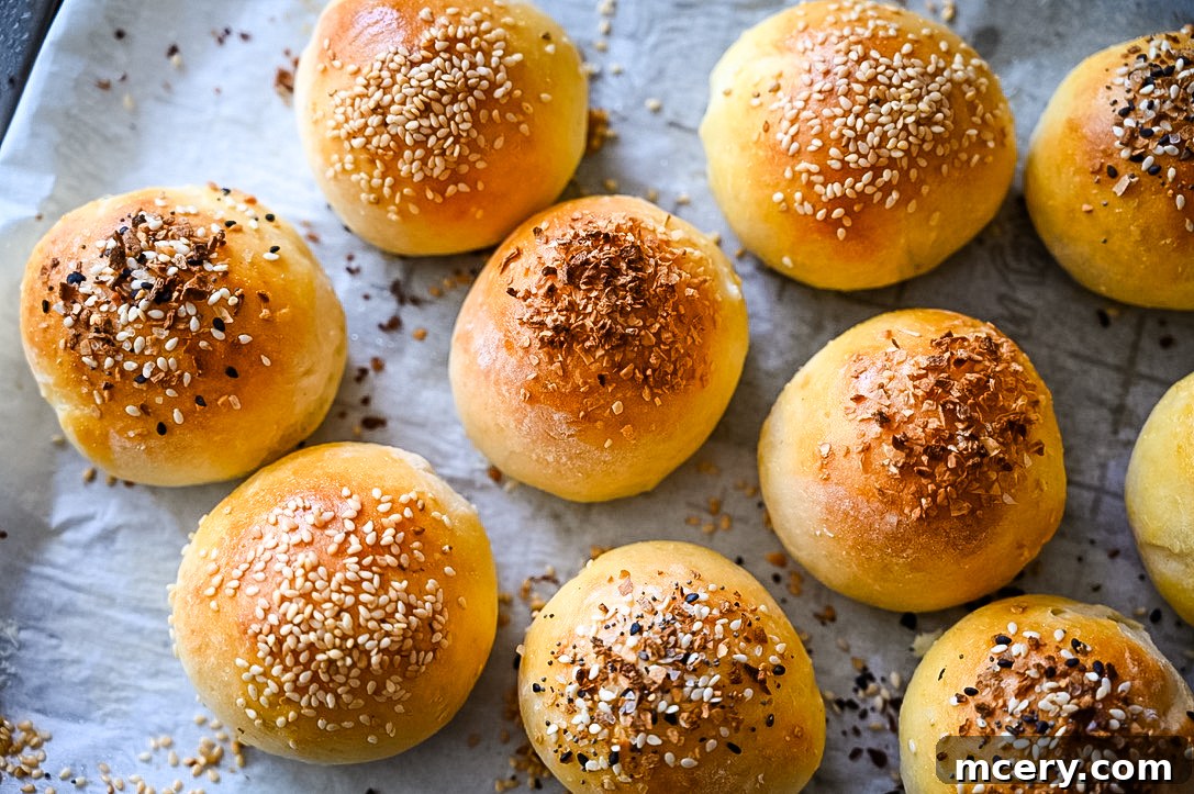 Bagel Bombs 5 A platter of freshly baked stuffed bagel bites, topped with seeds, indicating they are ready for serving.