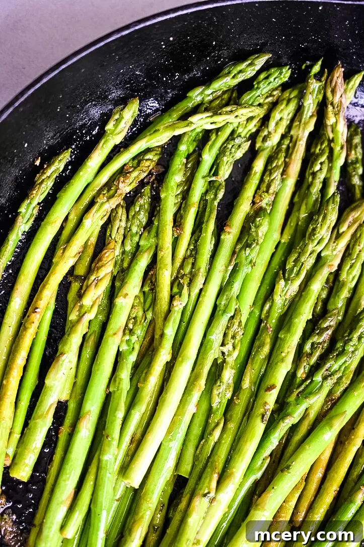Bright and Speedy Lemon Garlic Asparagus 4 Close-up of Lemon Garlic Asparagus with cherry tomatoes and cheese