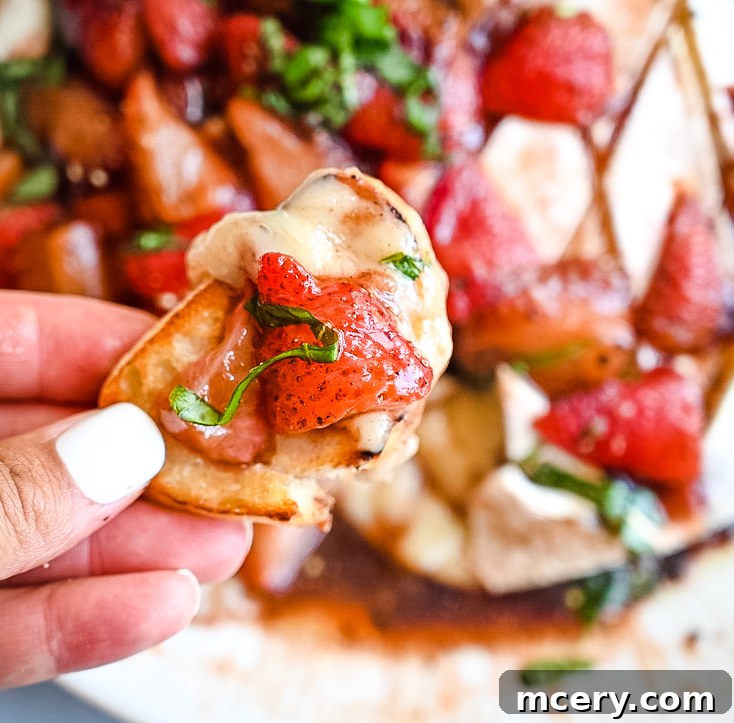 Strawberry Balsamic Baked Brie Summer Perfection 4 Close-up of Strawberry Balsamic Baked Brie with fresh basil garnish