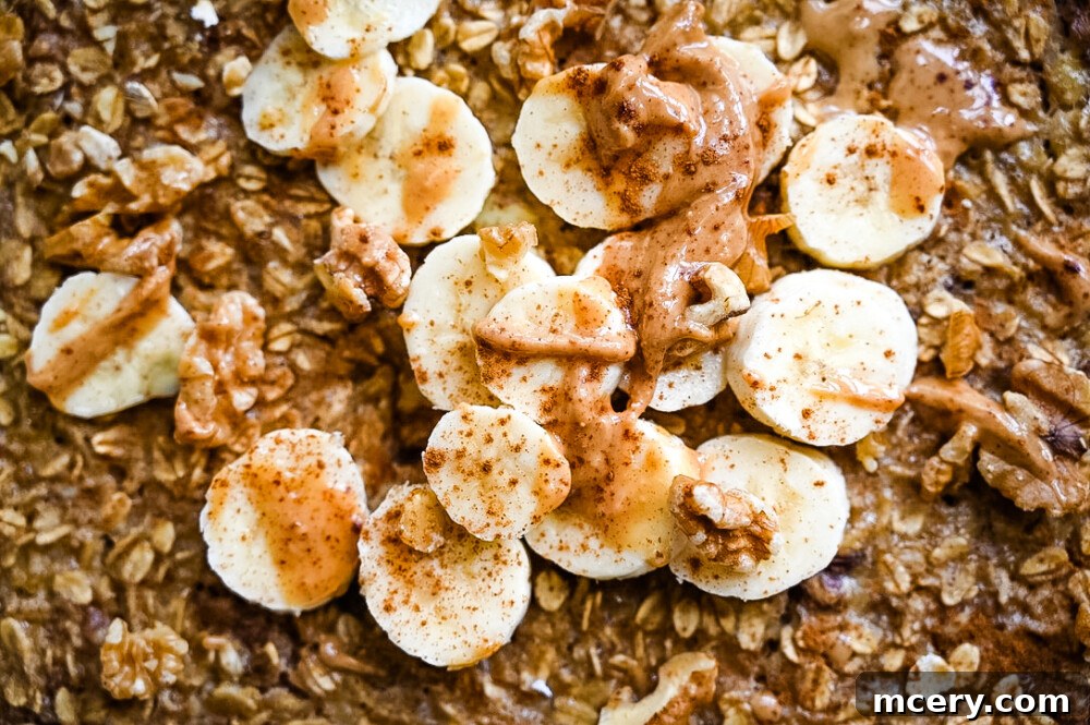Delicious and Nutritious Banana Bread Baked Oatmeal 2 Banana Bread Baked Oatmeal served in a bowl, garnished with fresh banana slices and a sprinkle of cinnamon, ready to be enjoyed.