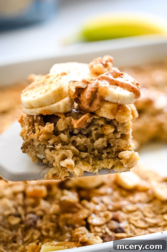 Delicious and Nutritious Banana Bread Baked Oatmeal 3 A close-up of a baking dish filled with golden-brown baked oatmeal, showing its tender, moist texture with visible oats and banana pieces.