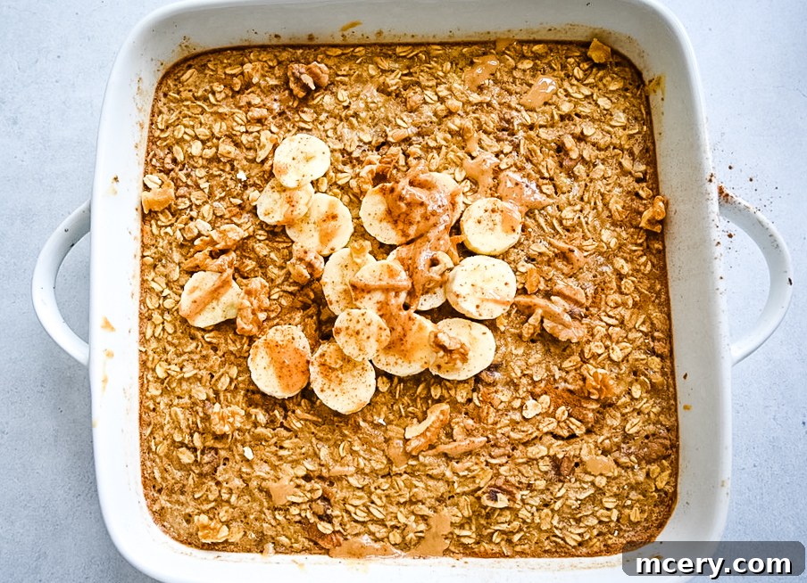 Delicious and Nutritious Banana Bread Baked Oatmeal 8 A rustic wooden table setting featuring a bowl of Banana Bread Baked Oatmeal, a mug of coffee, and some fresh bananas, creating a cozy breakfast scene.