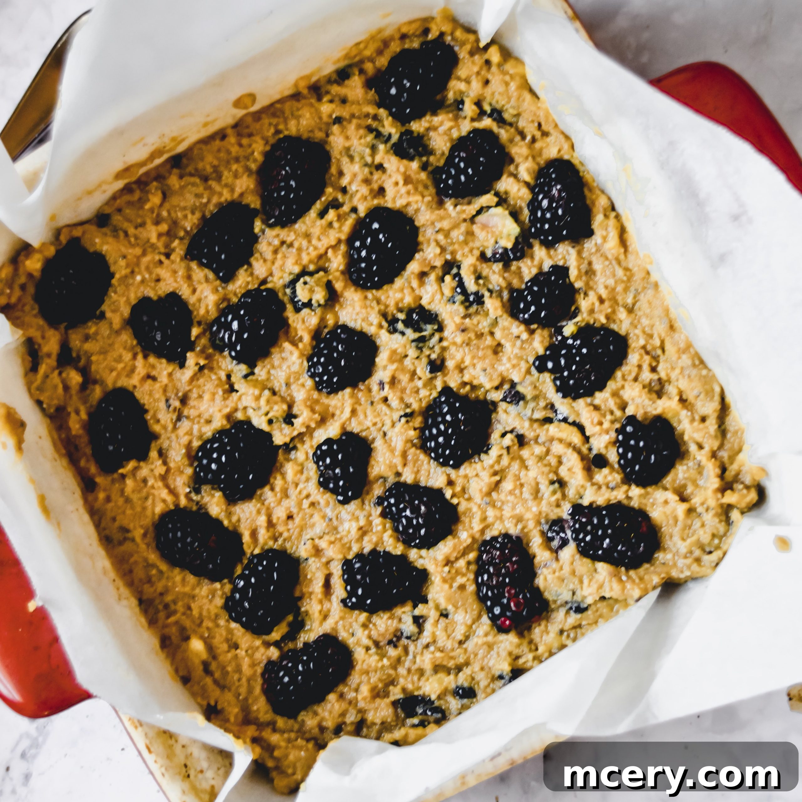 Blackberry Banana Bliss Bars 4 Blackberry banana bread baking in the oven, showing a beautiful golden crust with berries on top
