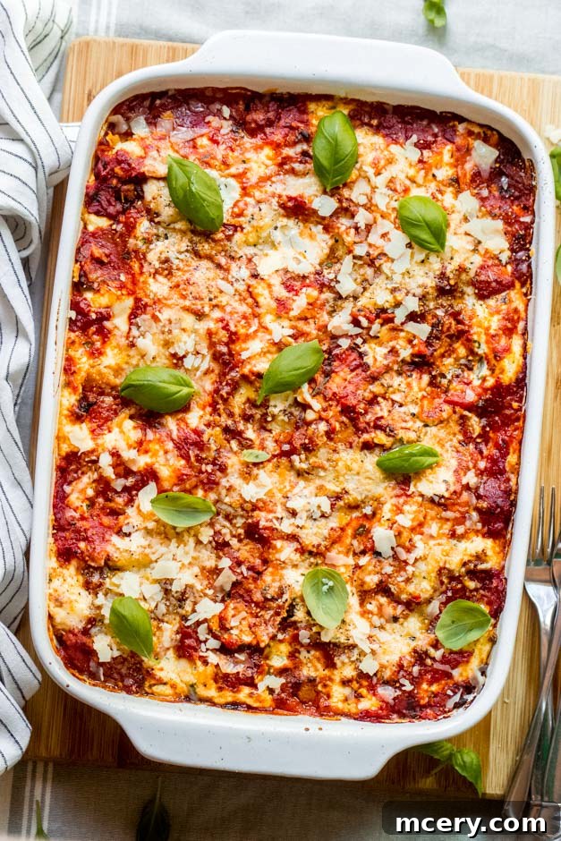Barefoot Contessa's Turkey Lasagna 10 ina garten lasagna with basil in a baking dish.