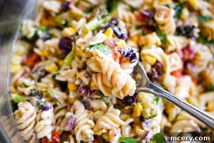 Mediterranean Hummus Pasta Delight 5 Close-up shot of Hummus Pasta Salad with a focus on ingredients.