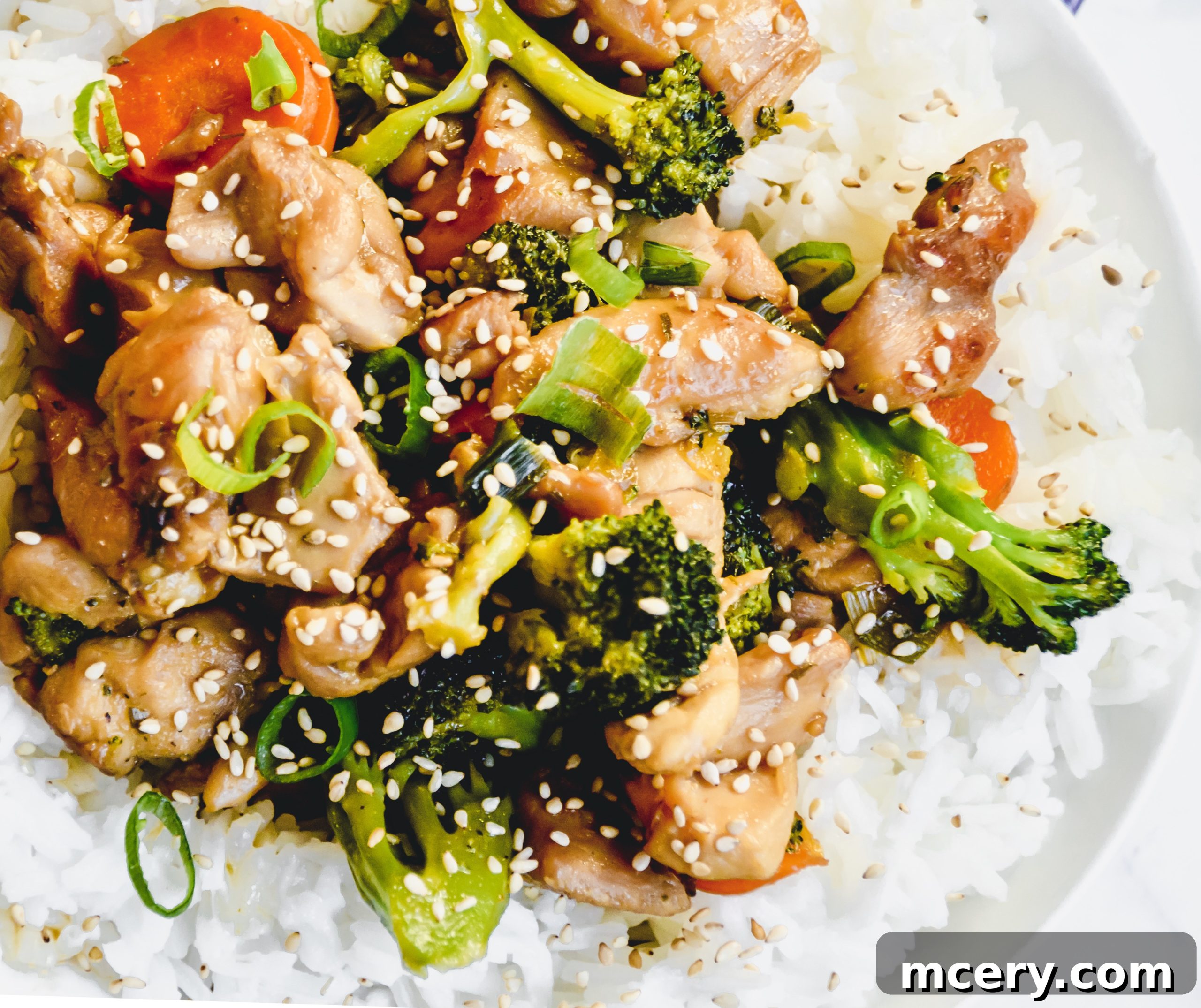 Quick and Flavorful Teriyaki Chicken Rice Bowls 4 A collection of fresh ingredients for homemade teriyaki sauce, including rice vinegar, agave, and minced garlic, arranged on a rustic wooden surface.