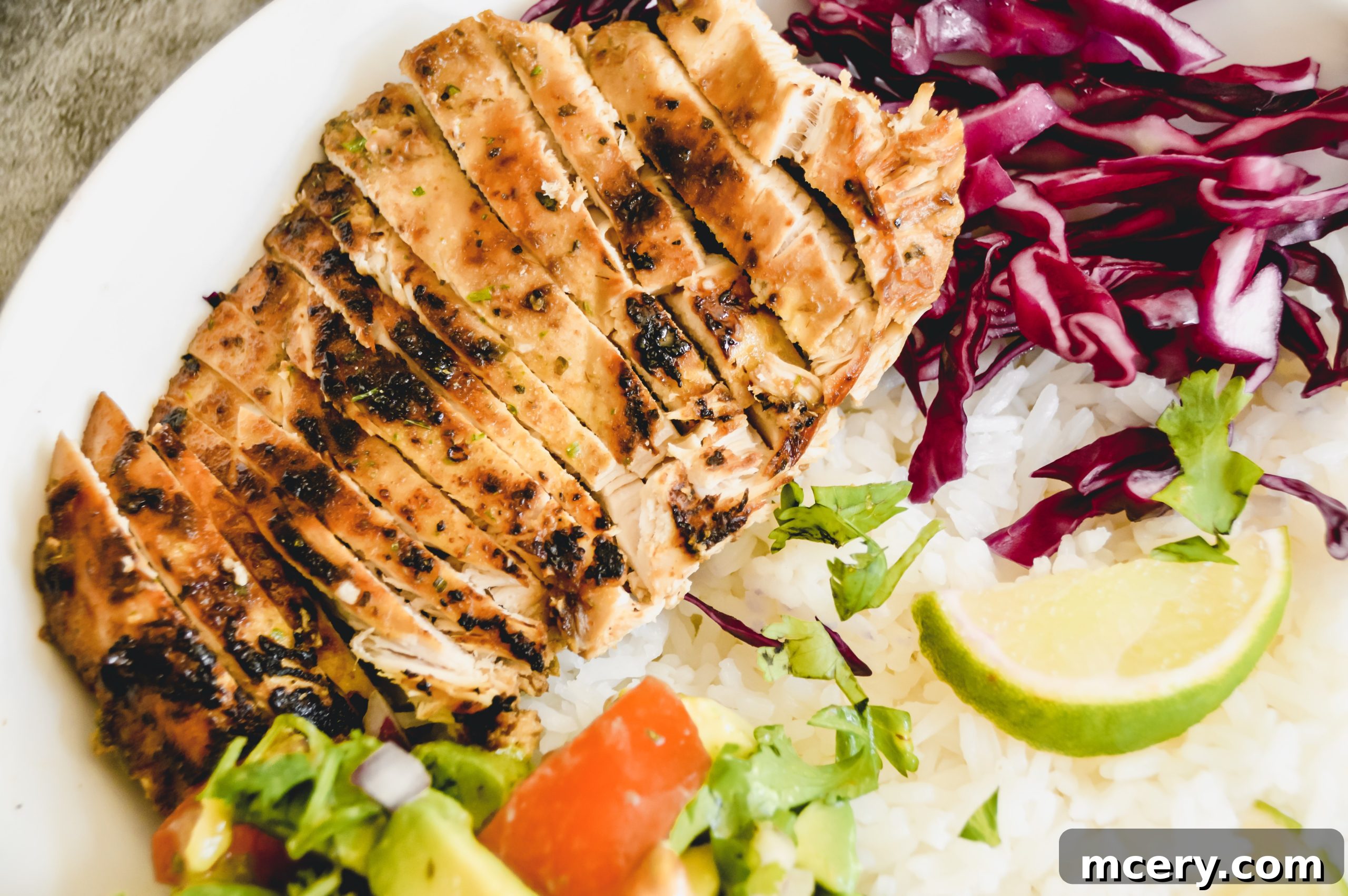 Close-up of marinated Pollo Asado chicken pieces ready for cooking