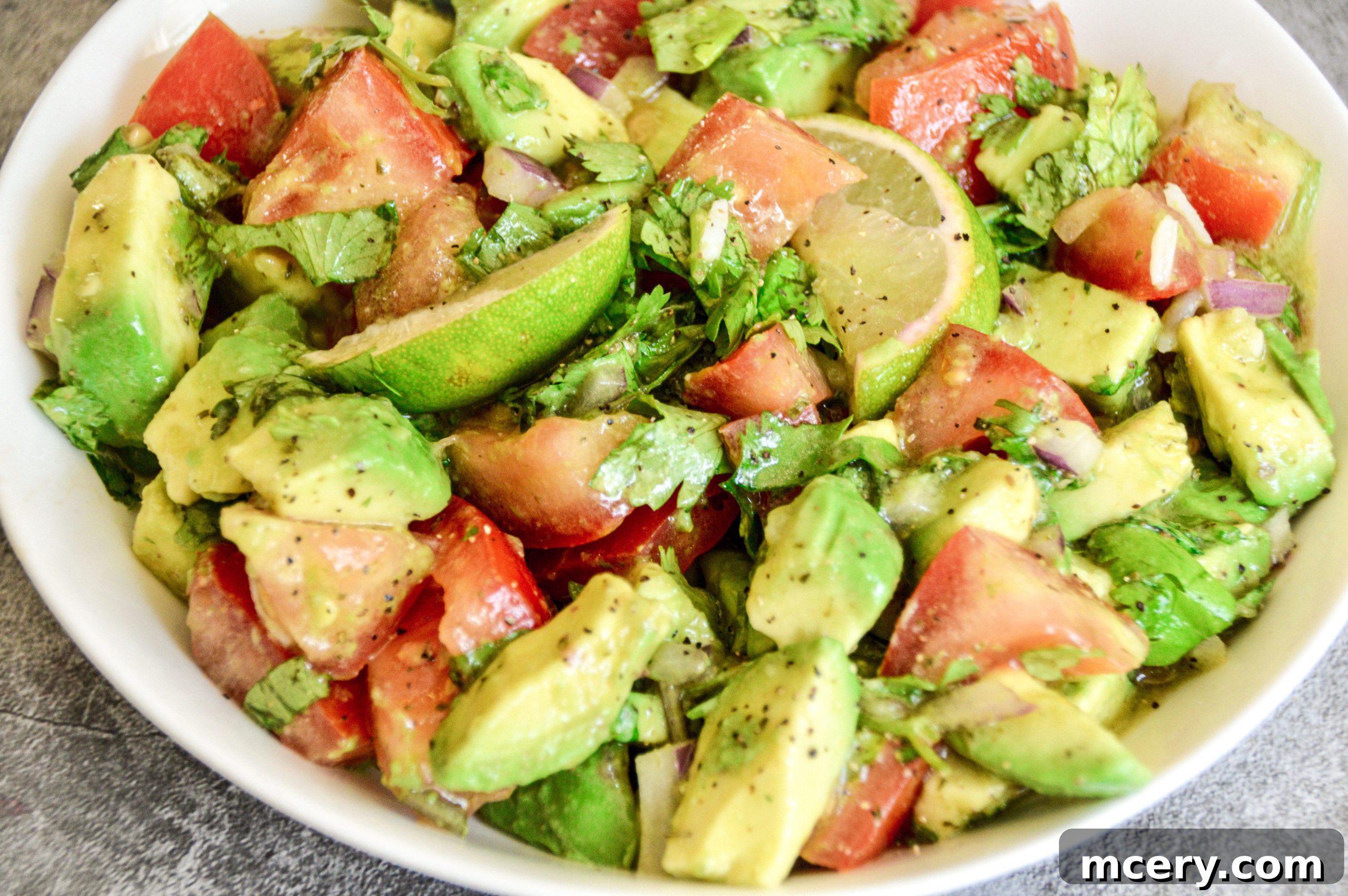 Perfectly cooked Pollo Asado chicken with vibrant avocado salad and rice