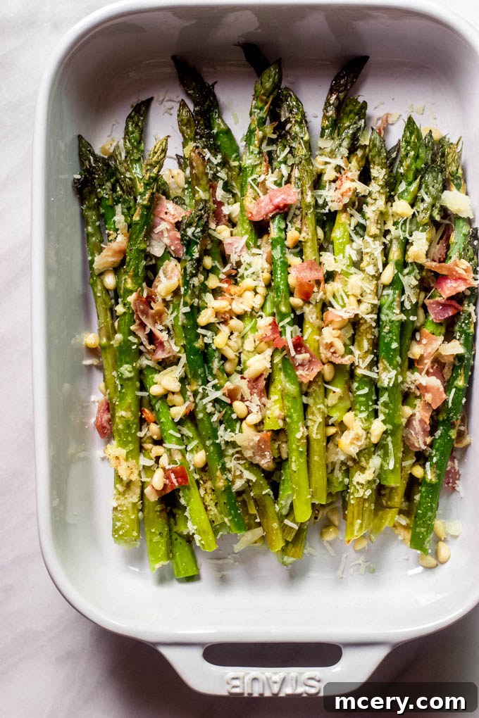 Silky Parmesan Asparagus with Crispy Prosciutto</pre> 6 Close-up of the finished Parmesan roasted asparagus dish, beautifully garnished with fresh lemon wedges