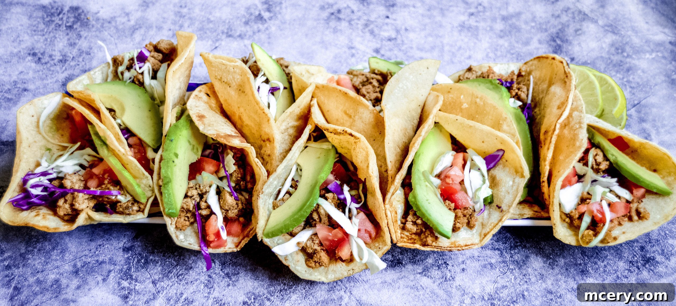 Flavorful & Fast Turkey Tacos 2 A vibrant, close-up shot of ground turkey tacos being prepared, with fresh ingredients and a homemade seasoning blend.