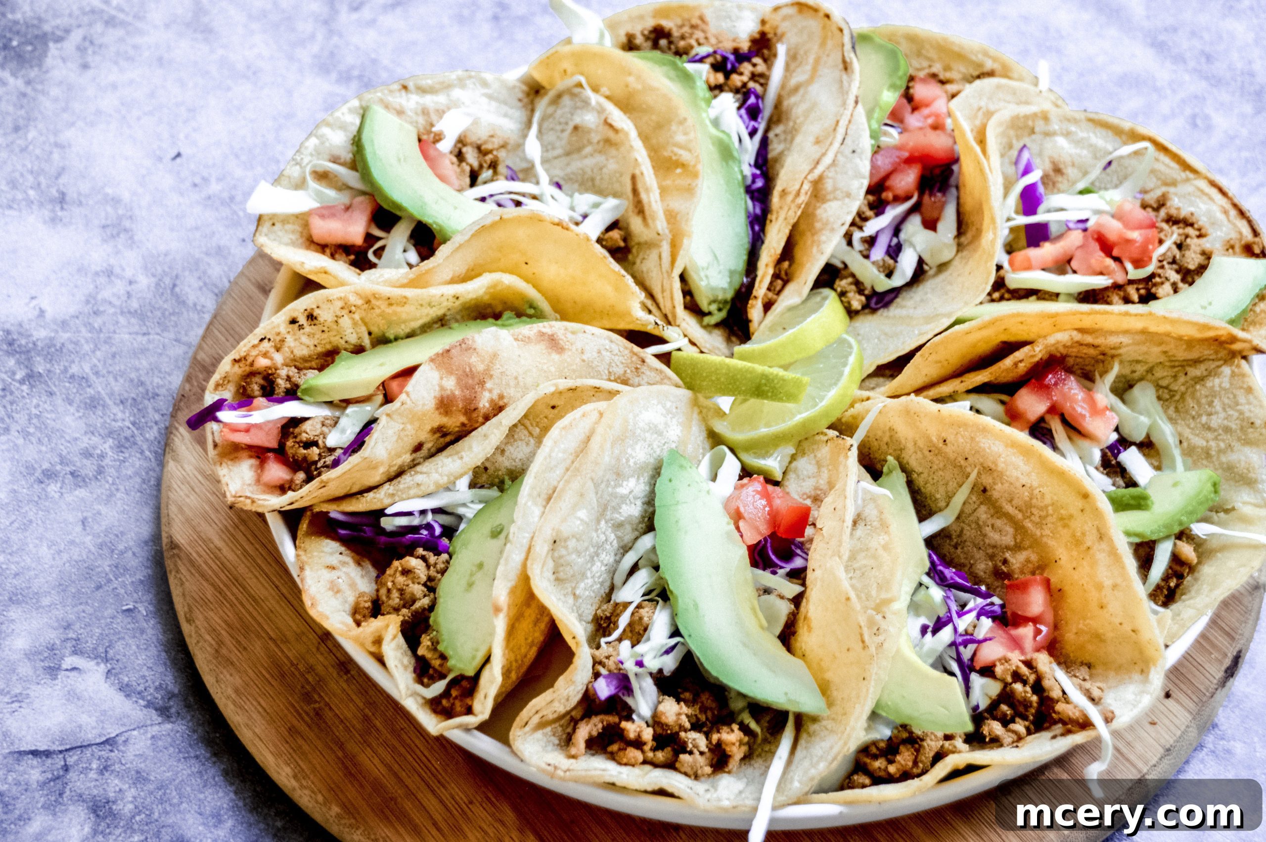 Flavorful & Fast Turkey Tacos 4 Close-up of a skillet filled with seasoned ground turkey and diced onions, simmering on the stovetop.