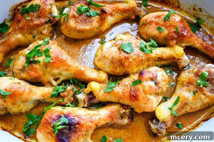 Sticky Honey Mustard Glazed Chicken Drumsticks 11 Plated honey mustard baked chicken drumsticks with a side dish.