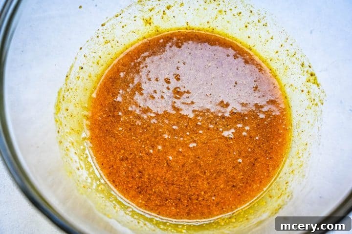 Sticky Honey Mustard Glazed Chicken Drumsticks 7 Coating chicken drumsticks in the honey mustard marinade.
