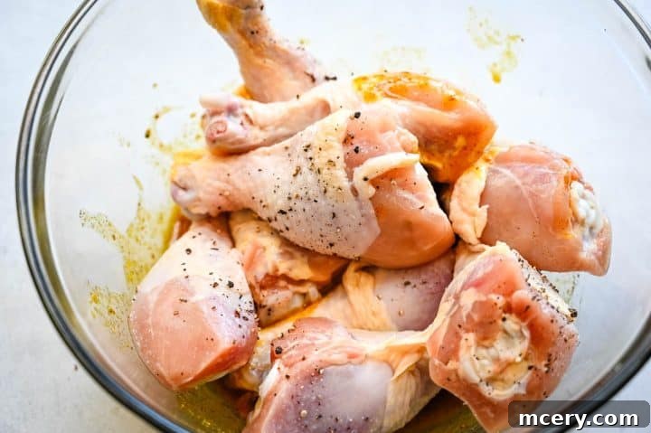 Sticky Honey Mustard Glazed Chicken Drumsticks 8 Arranging marinated chicken drumsticks in a baking dish.