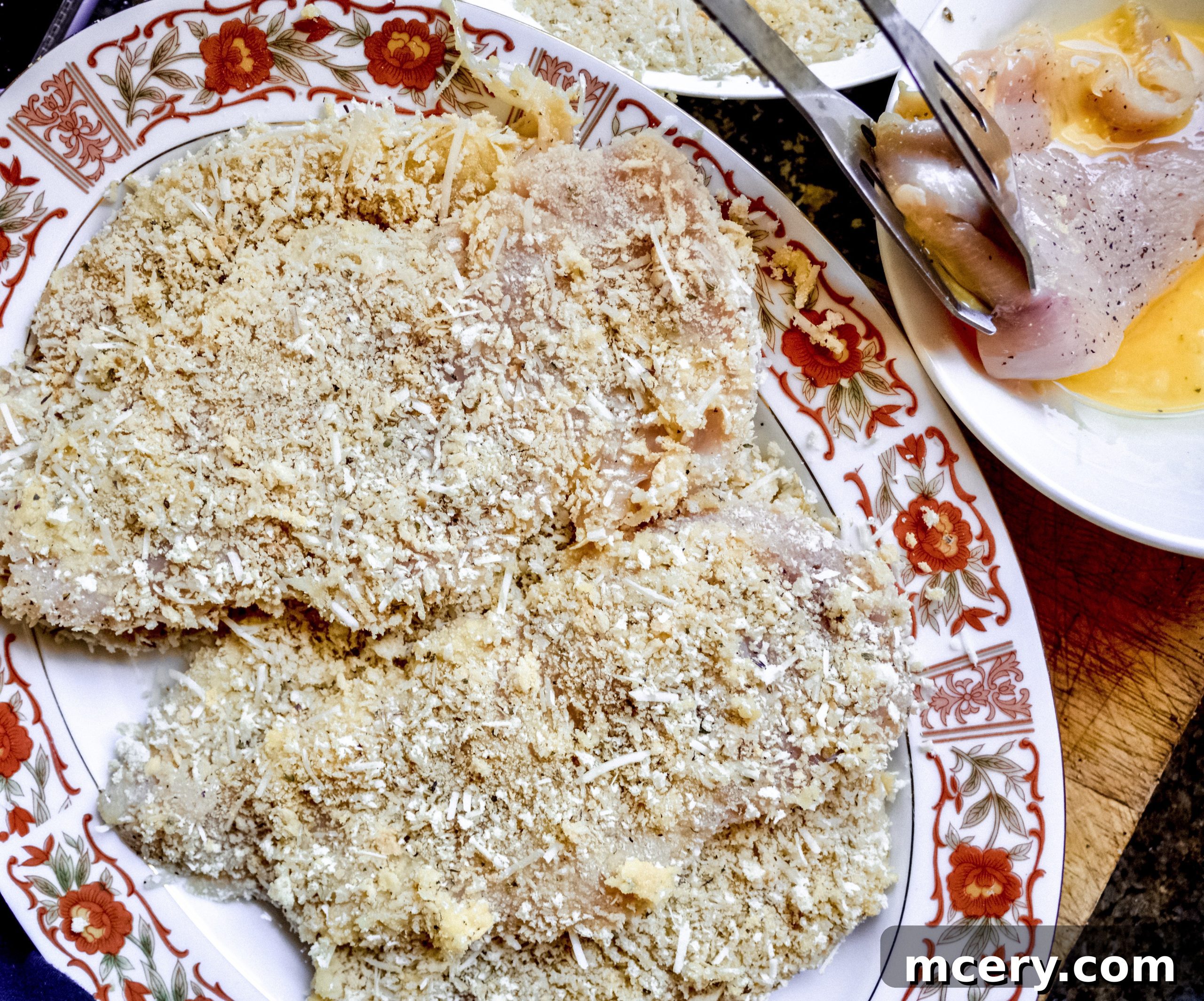 Parmesan Crusted Gluten-Free Chicken 4 Three shallow dishes prepared for dredging chicken: almond flour, beaten eggs, and panko-Parmesan mixture.