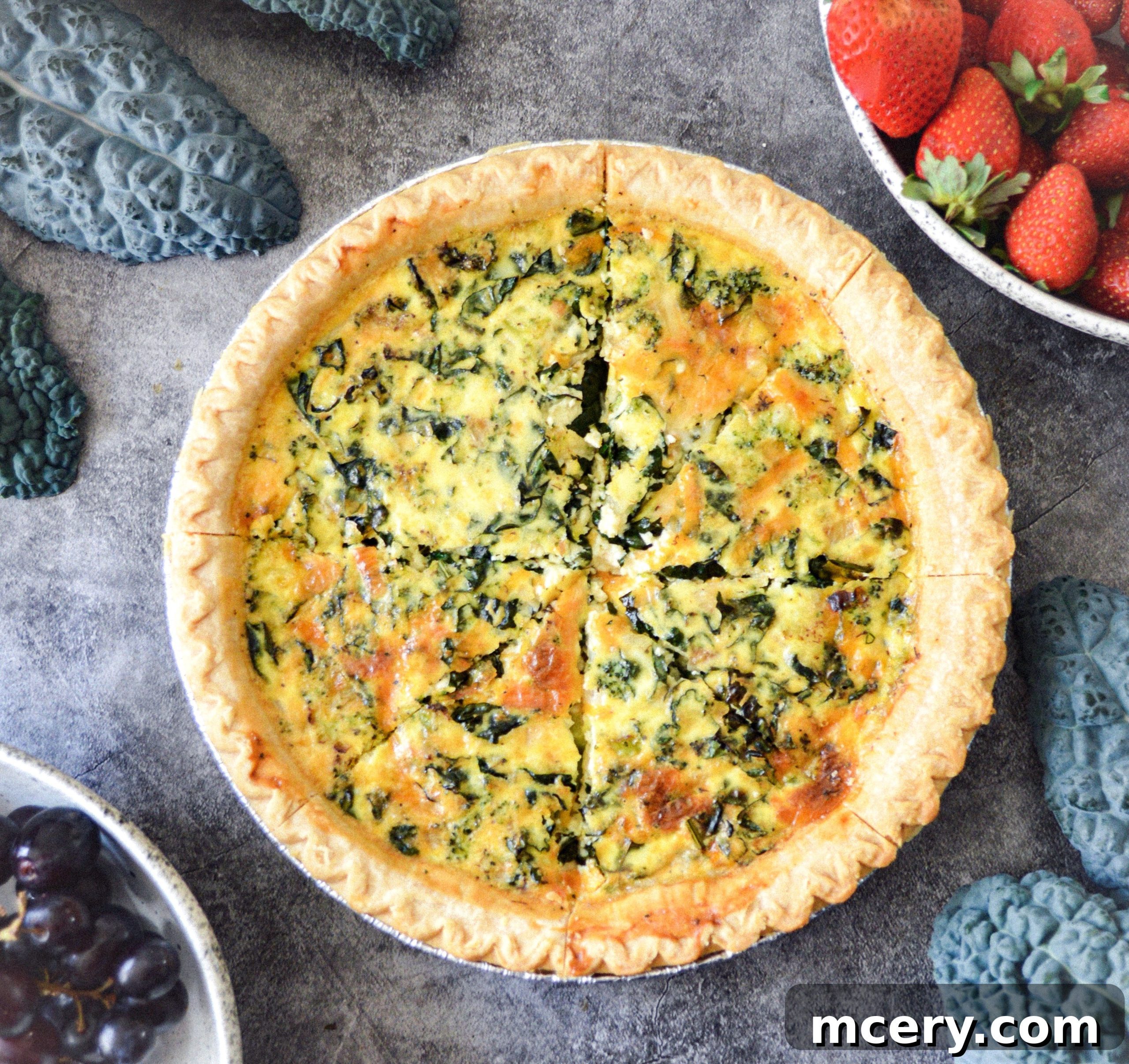 Wholesome Kale, Broccoli, and Cheddar Quiche 2 Freshly baked broccoli, kale, and cheddar quiche with a golden crust, sliced and ready to serve.
