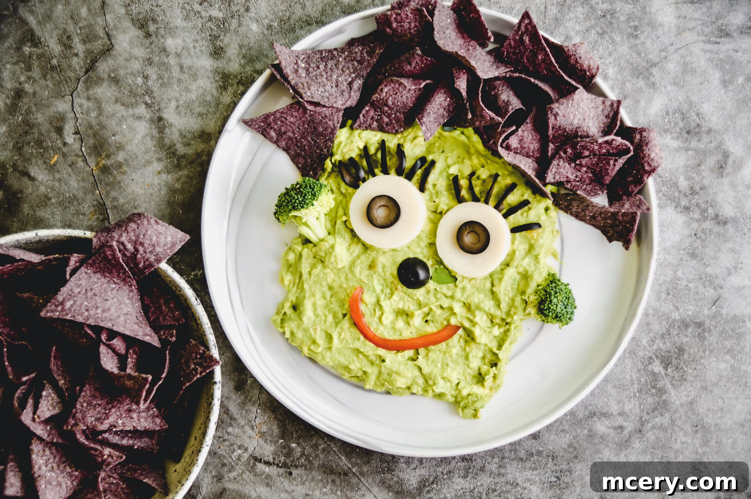A collection of vibrant ingredients laid out, ready to be transformed into a festive Halloween dish.