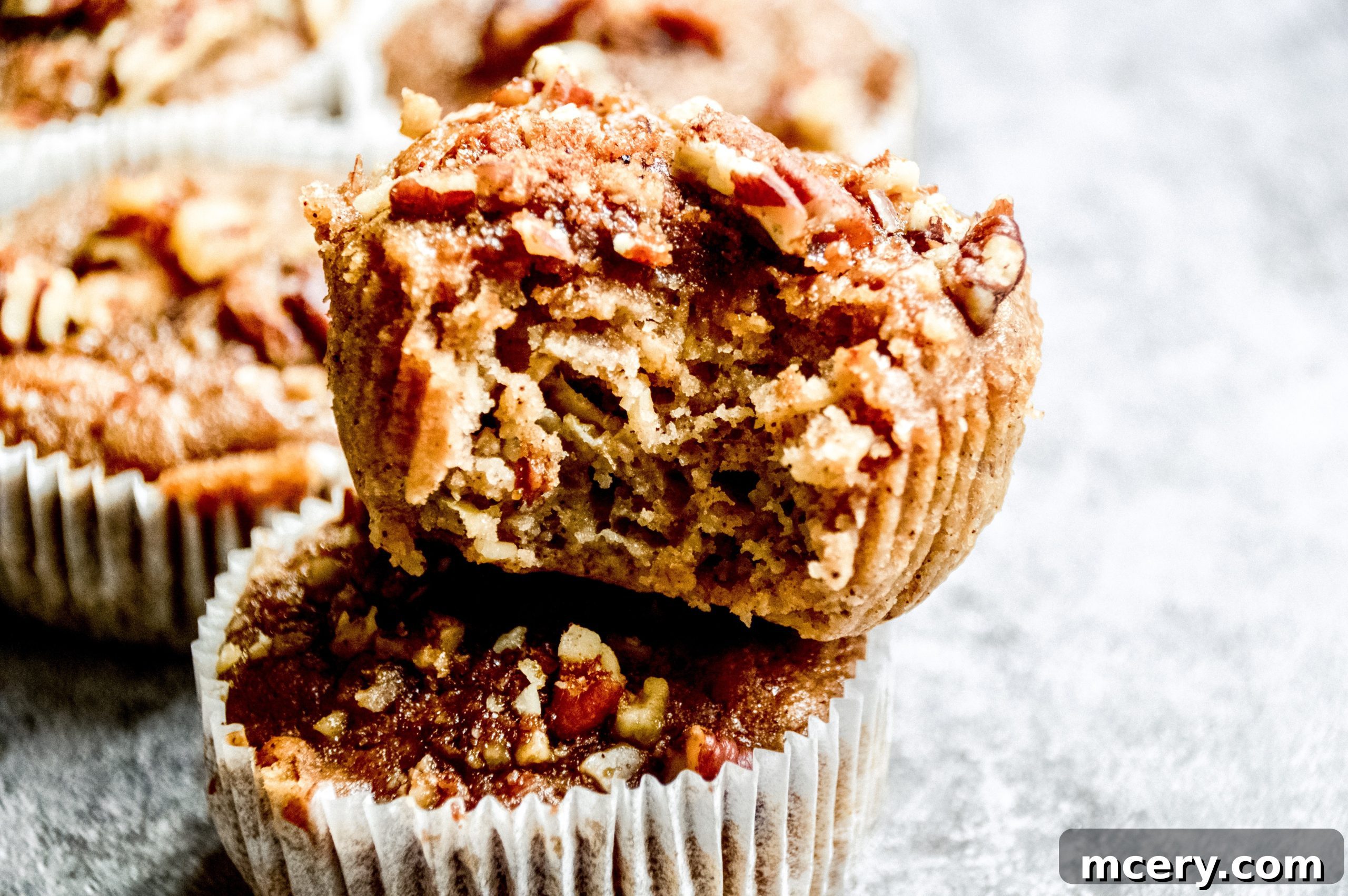 Moist Vegan Banana Cinnamon Muffins 5 A child's hand reaching for a freshly baked vegan banana cinnamon muffin.
