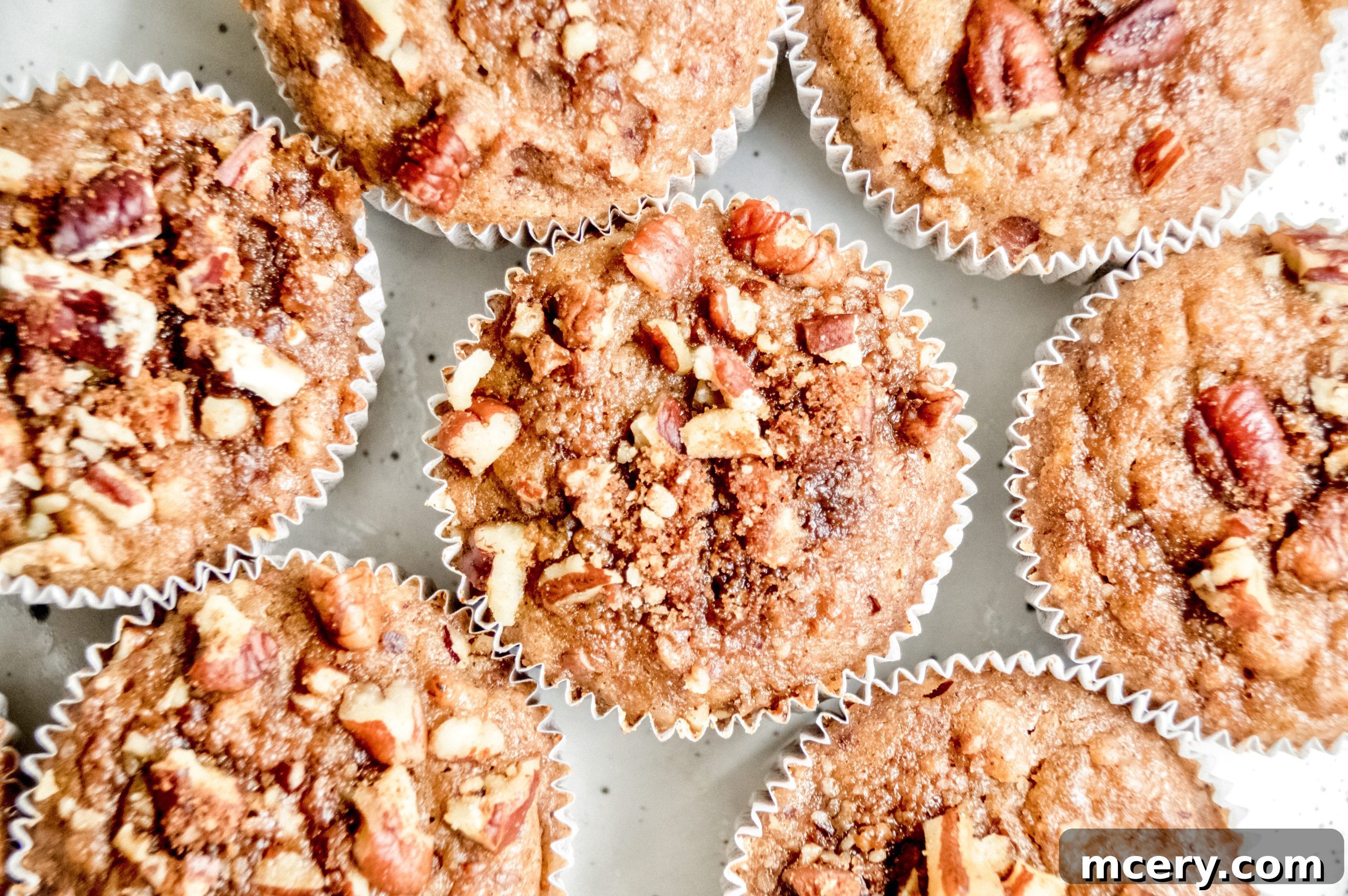 Moist Vegan Banana Cinnamon Muffins 6 A basket full of freshly baked vegan banana cinnamon muffins with a rustic feel.
