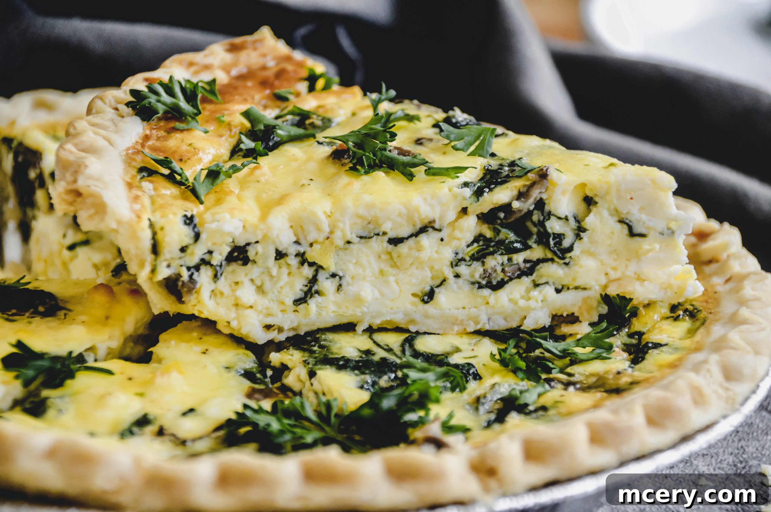 Freshly baked Spinach, Mushroom, and Feta Quiche cooling on a wire rack, ready to be served.