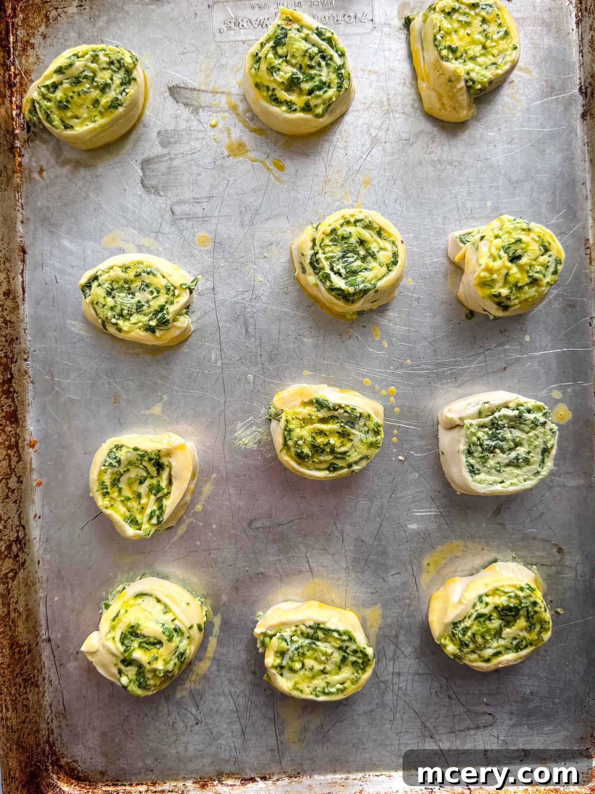 Savory Spinach and Cheese Puff Pastry Swirls 10 Spinach and cheese pinwheels with a bowl of dip