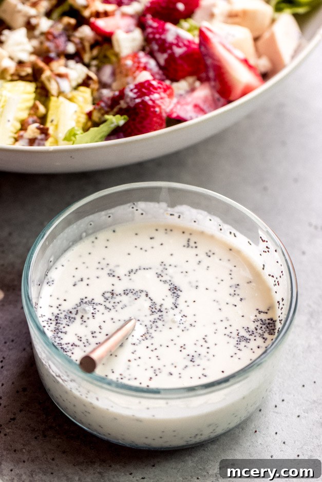 Fresh Homemade Poppy Seed Dressing 2 Homemade Poppy Seed Dressing in a glass jar, ready to be drizzled over a fresh salad