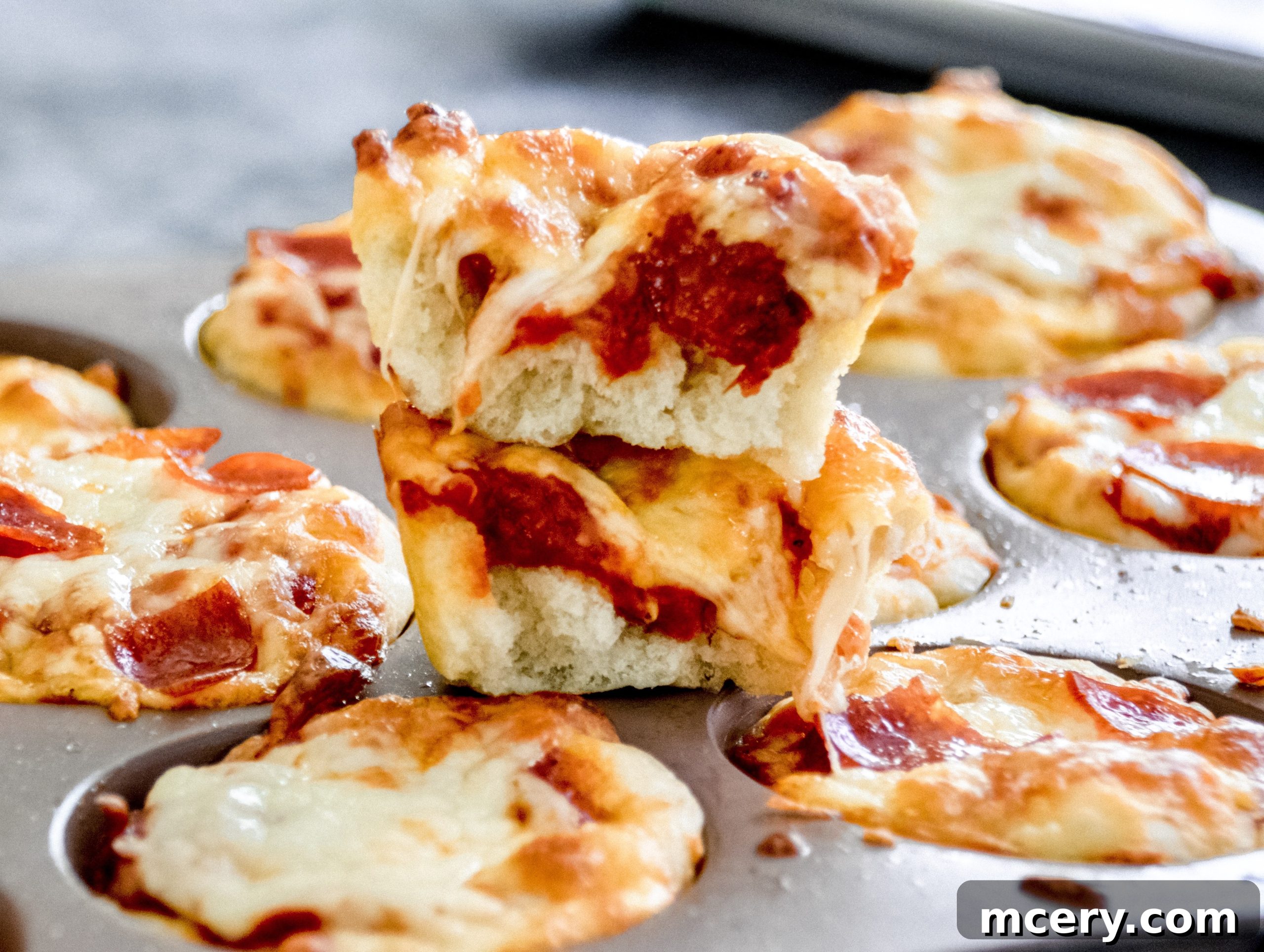 Easy Kid-Friendly Mini Pizza Bites for Meal Prep 3 A serving platter filled with mini pizza bites, showing the crispy crust and melted cheese, ready for guests.