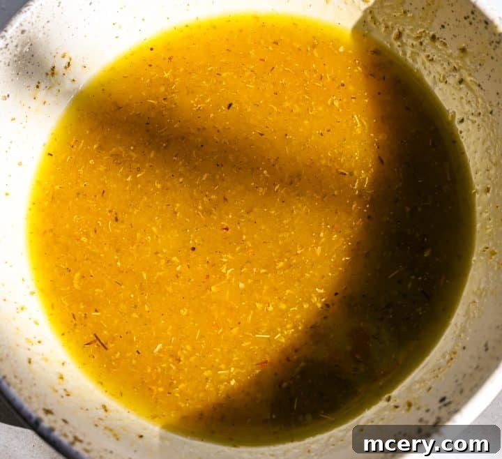 Crimson and Evergreen Christmas Chopped Salad 6 Step-by-step image of shaking the salad dressing in a jar