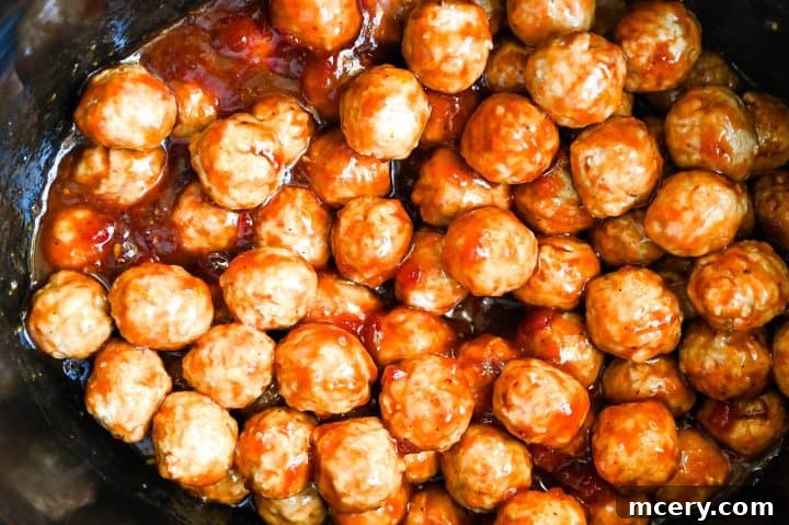 Cranberry Glazed Holiday Meatballs 7 Step 4: Honey and orange zest are added to the sauce.