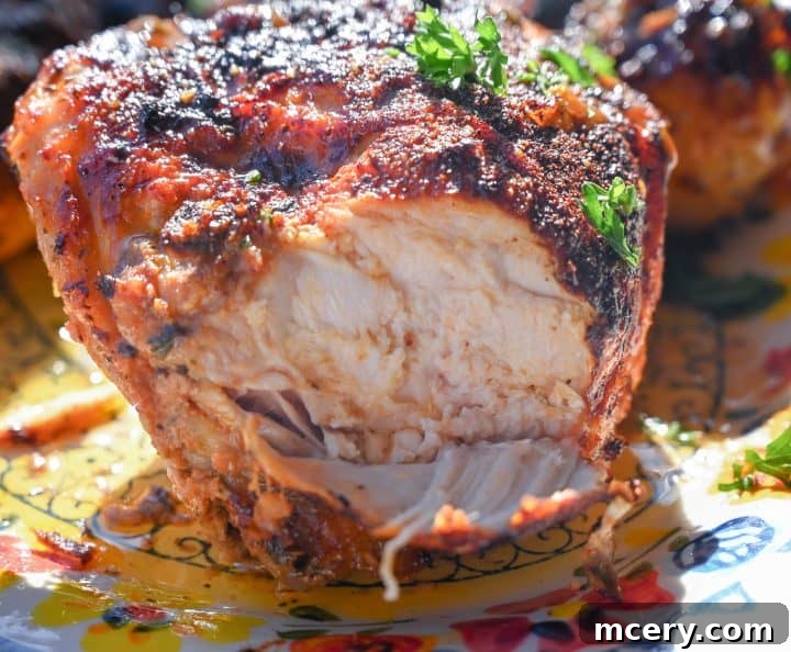 Close-up of golden, crispy chicken skin, highlighting the texture and color.