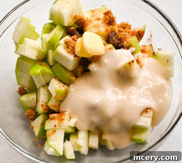 Golden Apple Cinnamon Pull-Apart Bake 8 Prep step: Diced apples tossed with butter, brown sugar, and cinnamon.