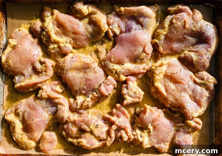 Honey Mustard Chicken One Pan Feast 7 Several pieces of finished honey mustard chicken arranged on a serving plate.