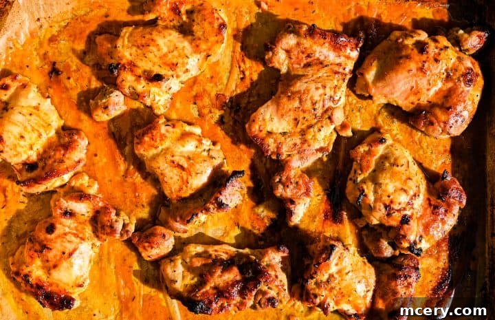 Honey Mustard Chicken One Pan Feast 8 The full sheet pan of golden-brown honey mustard chicken fresh out of the oven.