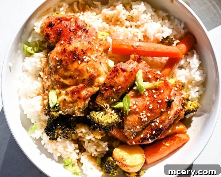 Sticky Honey Garlic Chicken and Roasted Vegetables 3 Honey garlic chicken and veggies served in a bowl with rice