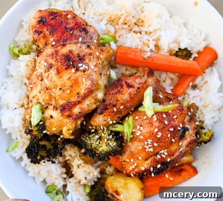 Sticky Honey Garlic Chicken and Roasted Vegetables 10 Full serving of honey garlic chicken and veggies with a fork