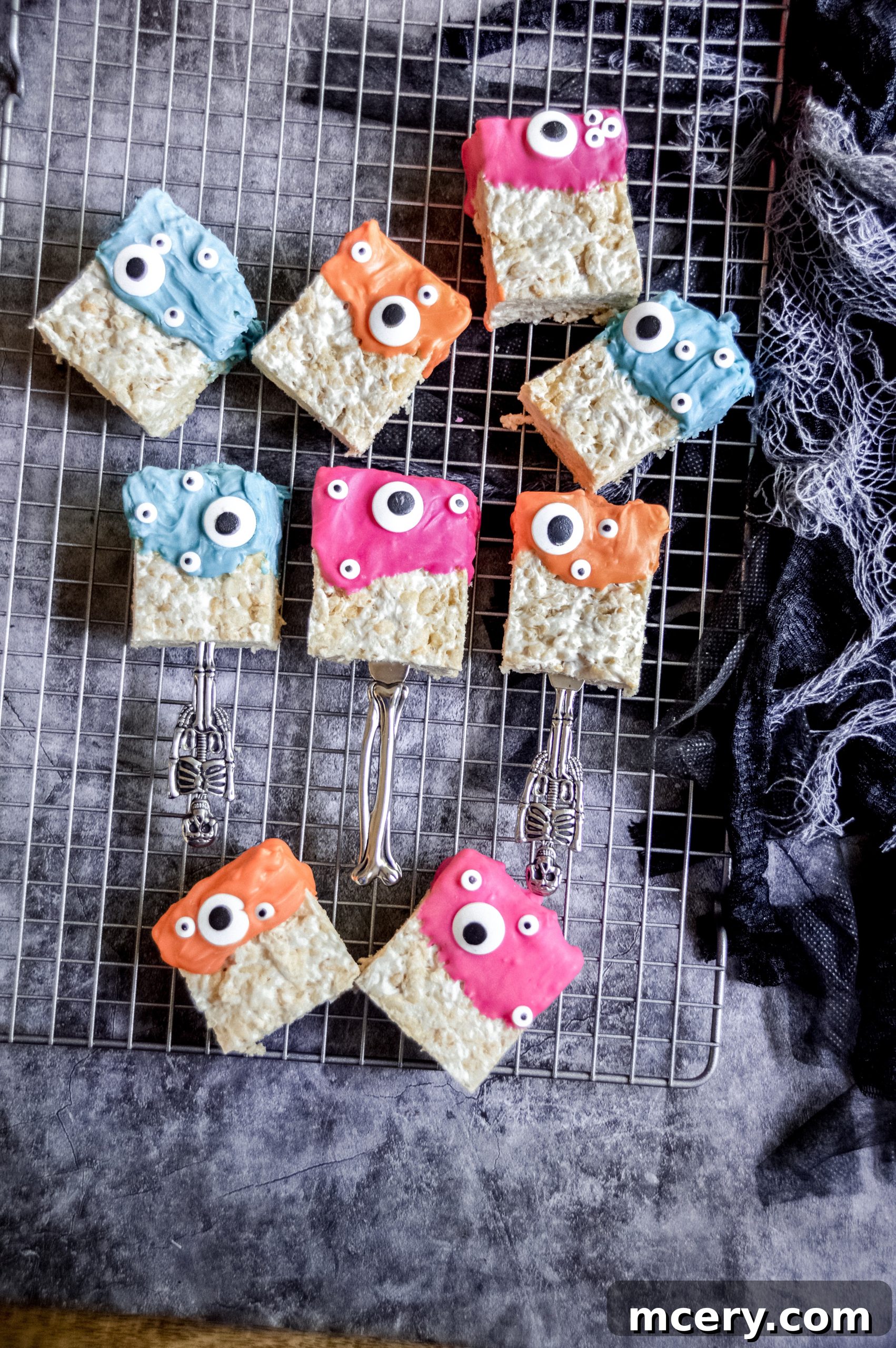 Spooktacular Rice Krispie Treats 3 Close-up of Monster Rice Krispies Treats with colorful candy melts and googly eyes, showcasing their whimsical design.