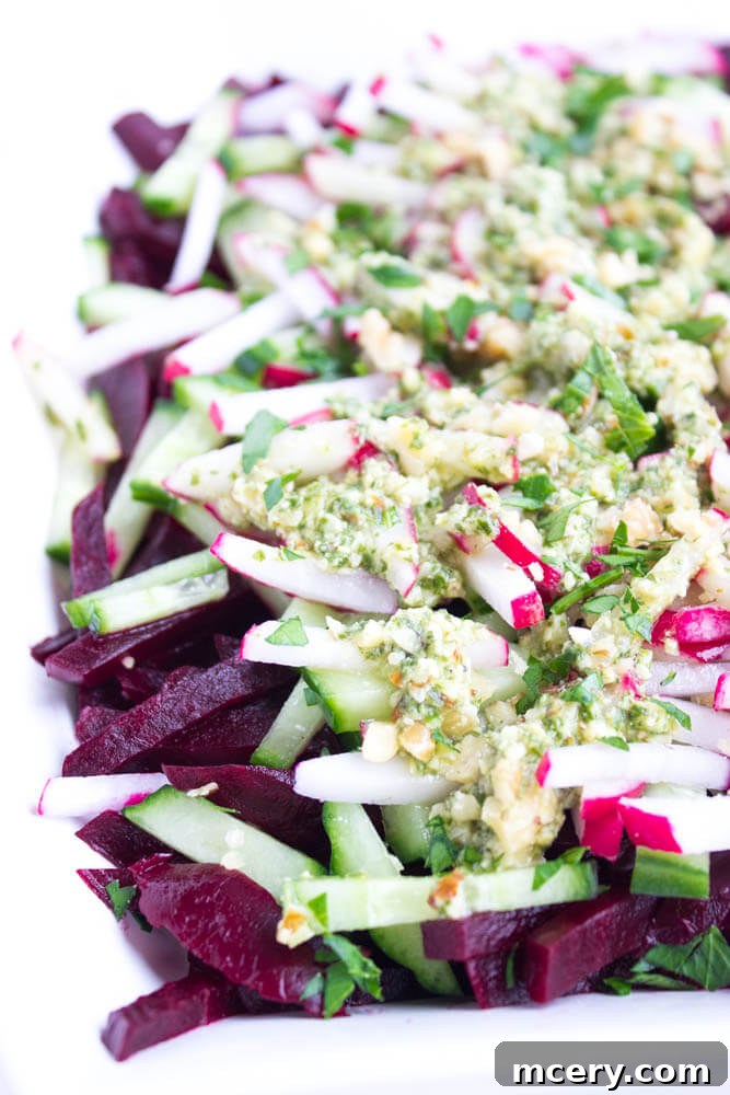 Ruby Root and Cucumber Delight with Basil Pesto Vinaigrette 2 Close-up of fresh Beet, Cucumber, and Radish Salad for a healthy side dish