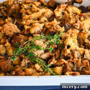 Delicious homemade stuffing, ready to be served, garnished with fresh thyme.