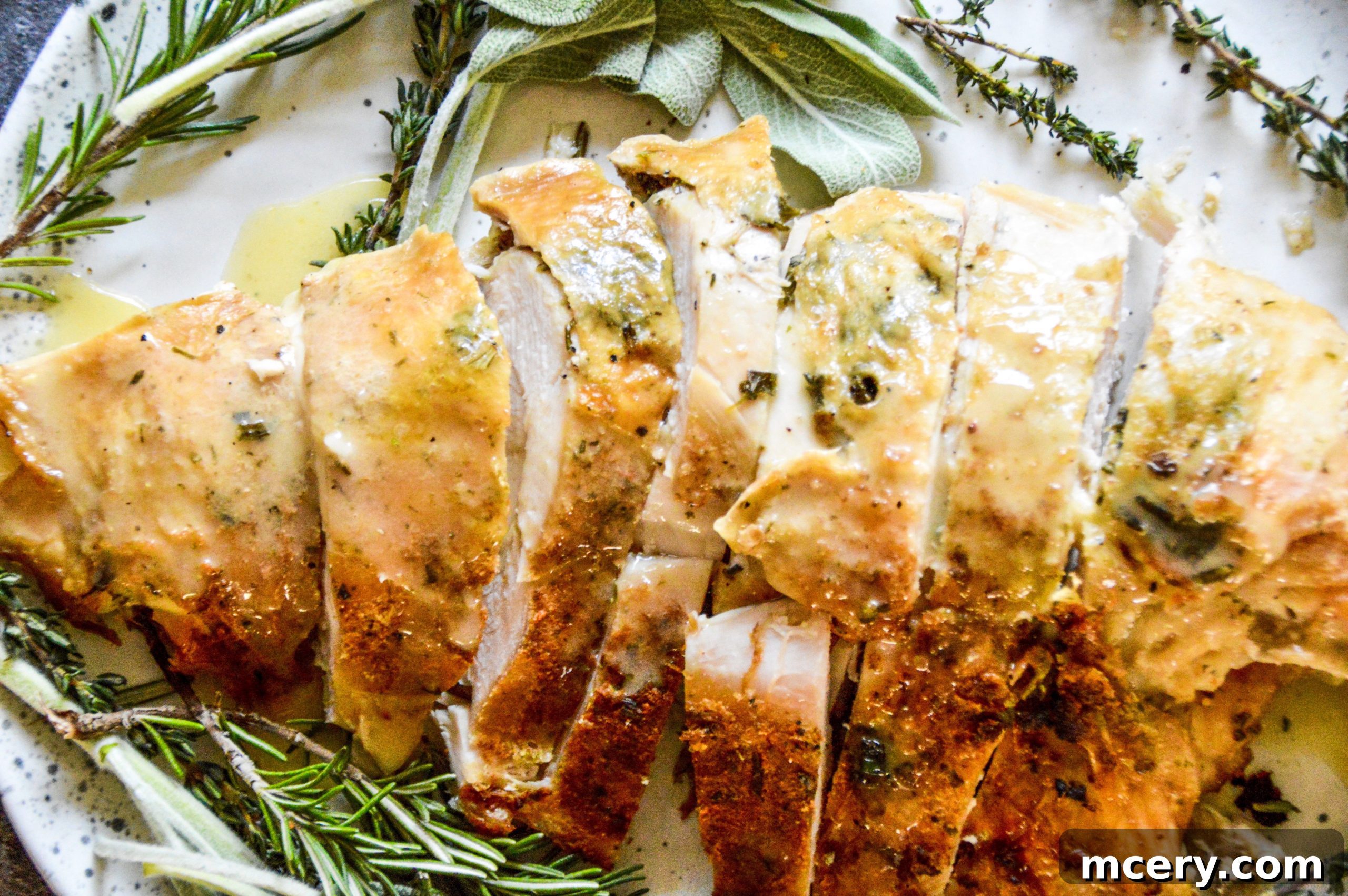Perfectly roasted slow cooker turkey breast, golden brown and garnished with fresh herbs, ready to be sliced.