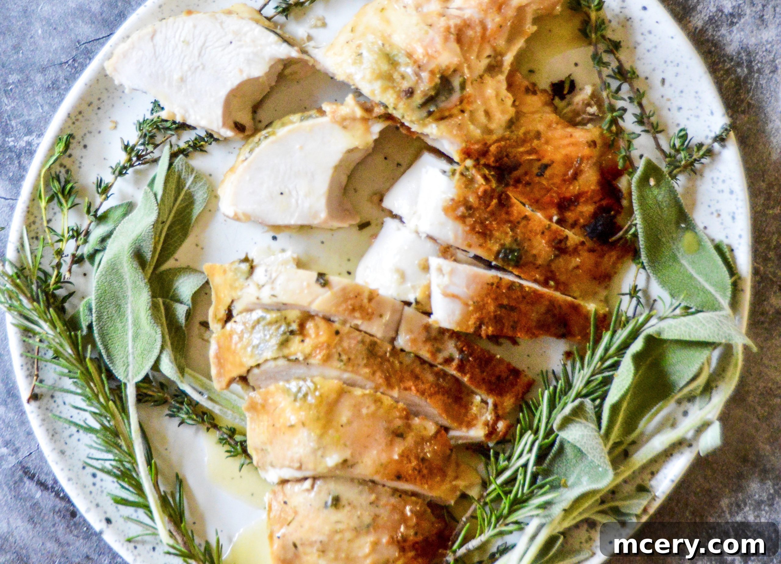 A succulent slice of slow cooker turkey breast on a cutting board, with visible juices and a golden crust.