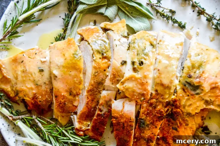 Garnished plate of slow cooker turkey breast with gravy
