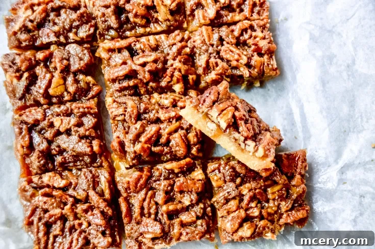 A Pecan Pie Bar on a vintage-style plate with a fork.
