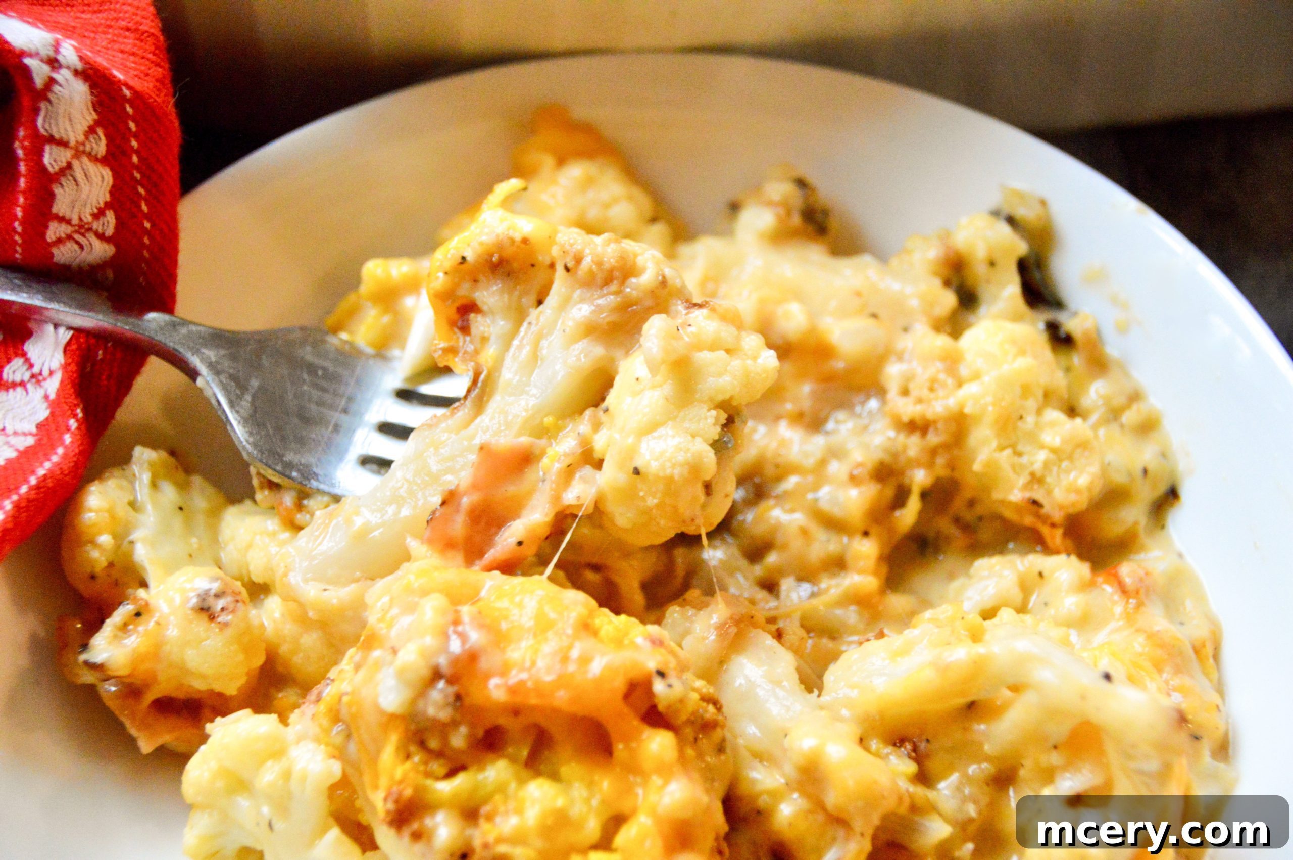 Golden Baked Cauliflower Mac & Cheese 4 Fresh cauliflower florets drizzled with olive oil, spread on a baking sheet, ready for roasting.