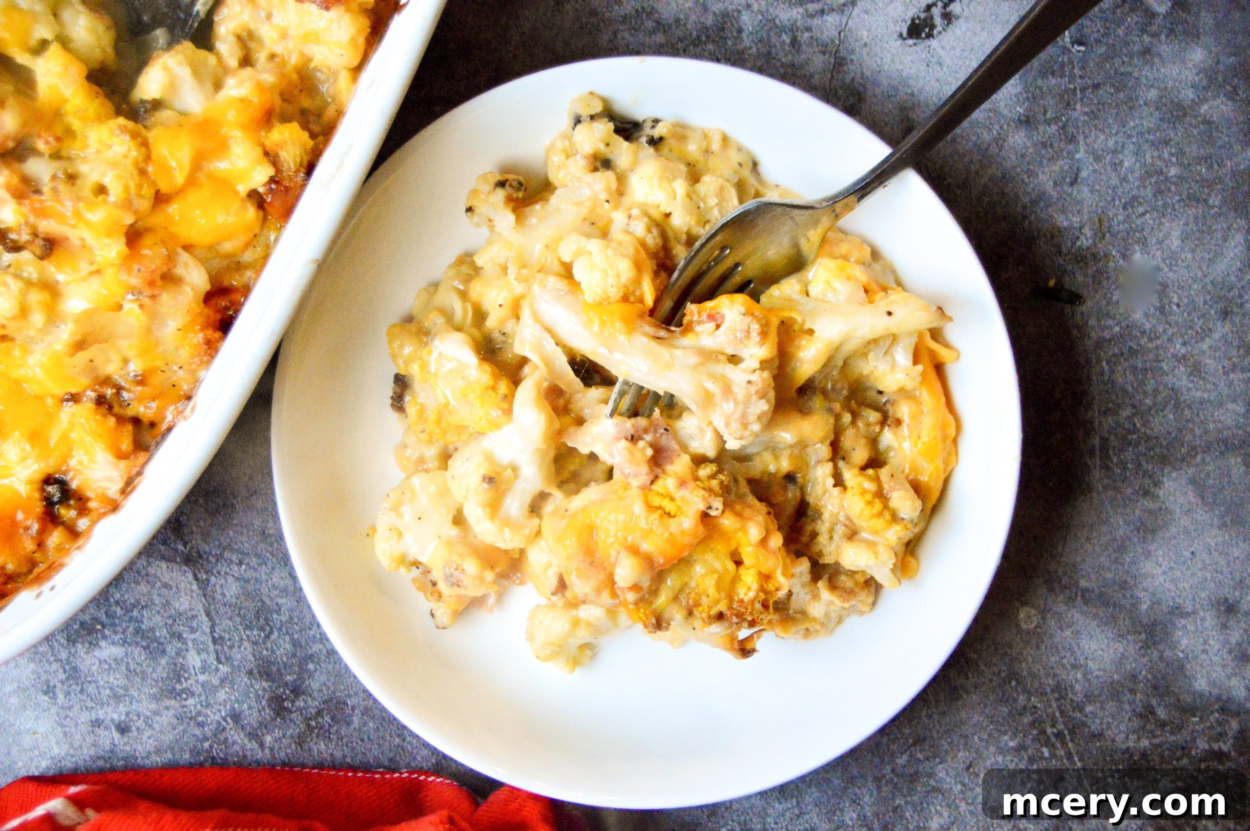 Golden Baked Cauliflower Mac & Cheese 7 A freshly baked casserole dish of cauliflower mac and cheese, still bubbling and golden brown from the oven.