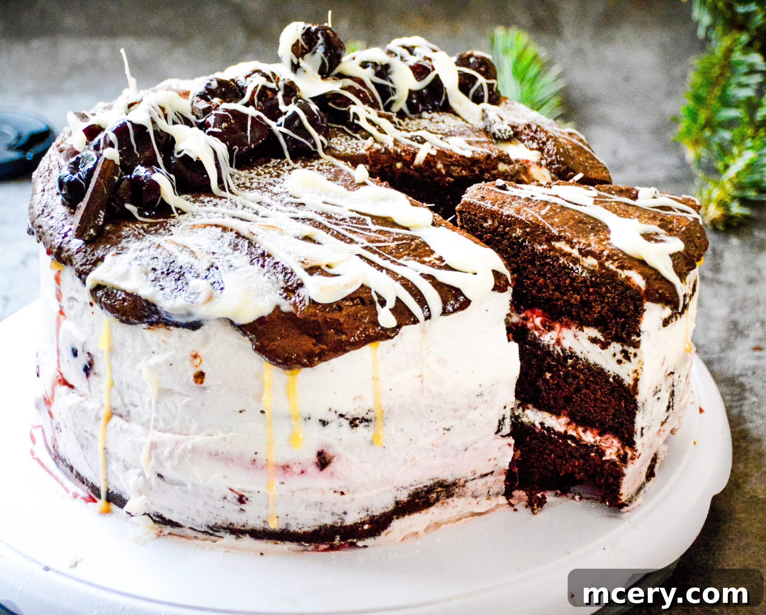 Close-up of the assembled Black Forest Cake with dripping chocolate ganache