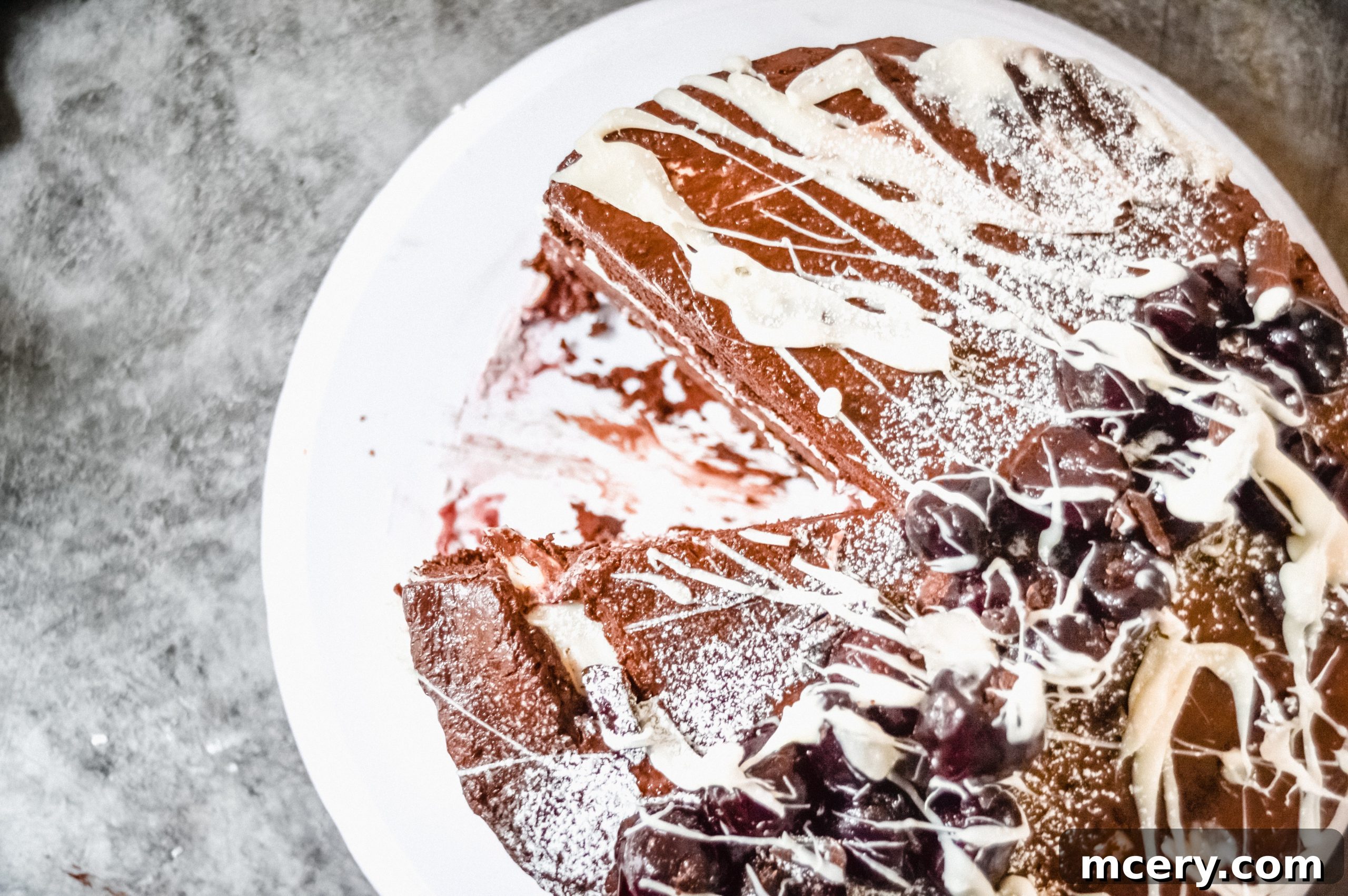 Black Forest Cake close-up, showcasing its delectable layers and chocolate garnish